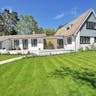 Move-In Ready – Don’t Miss This Beautiful Property! 4 Contemporary house exterior with large manicured lawn and beautiful garden.